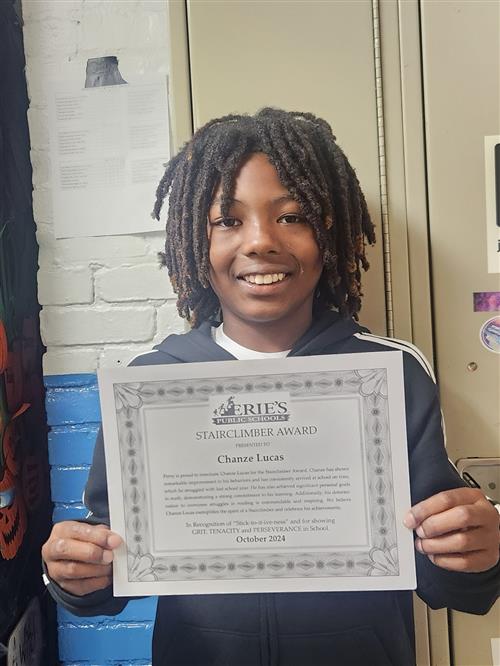 Chanze Lucas, Perry's October Stairclimber, poses with his certificate.